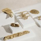 Luksusowe złote uchwyty meblowe Pieza Genesis L Genesis M Devon I Devon II Devon III Silur